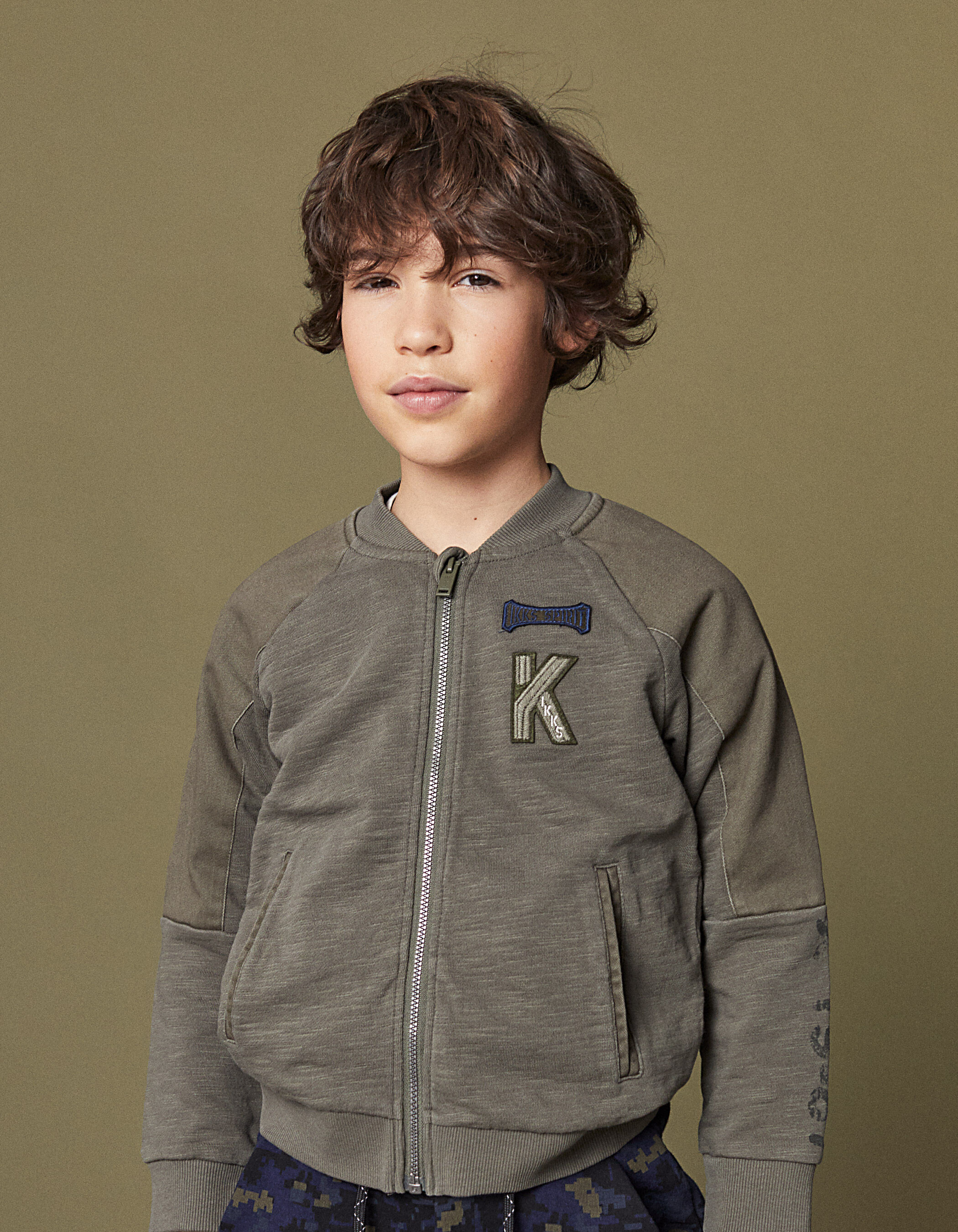 Boys bronze cardigan with chest patches and printed back