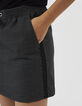 Falda corta negra jacquard con galones laterales I.Code-4