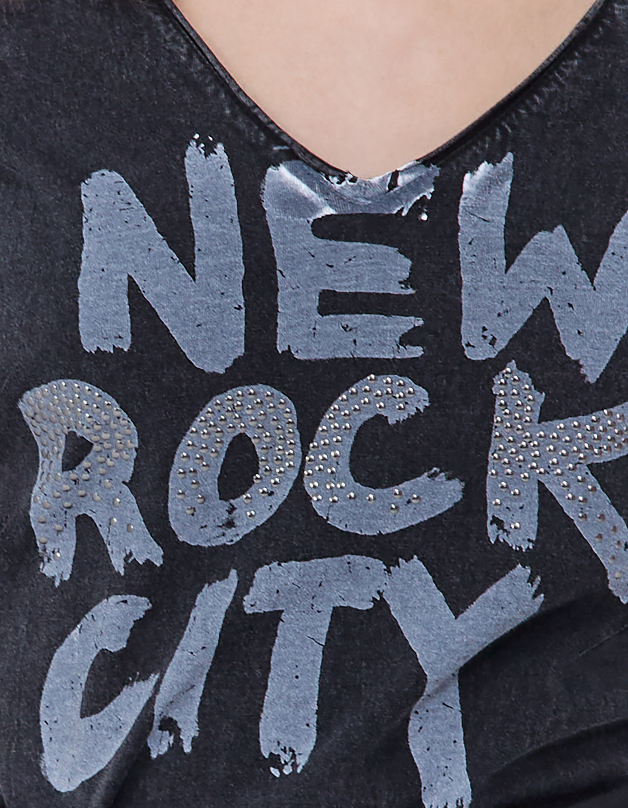 Women s black T shirt with Rock slogan and studs