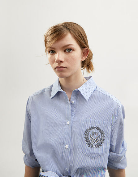 Girls’ light blue shirt with contrasting stripes