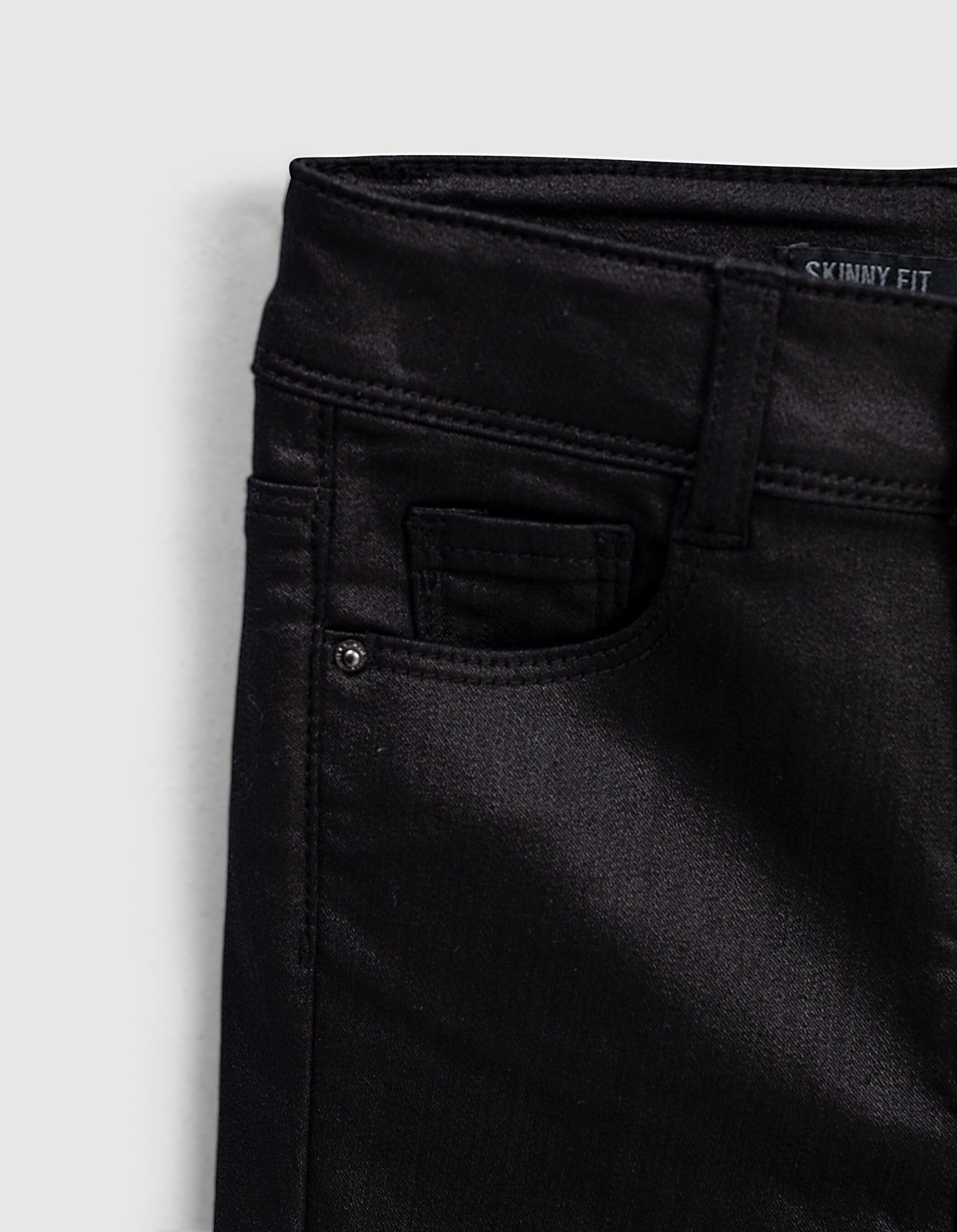 Girl's black coated skinny jeans