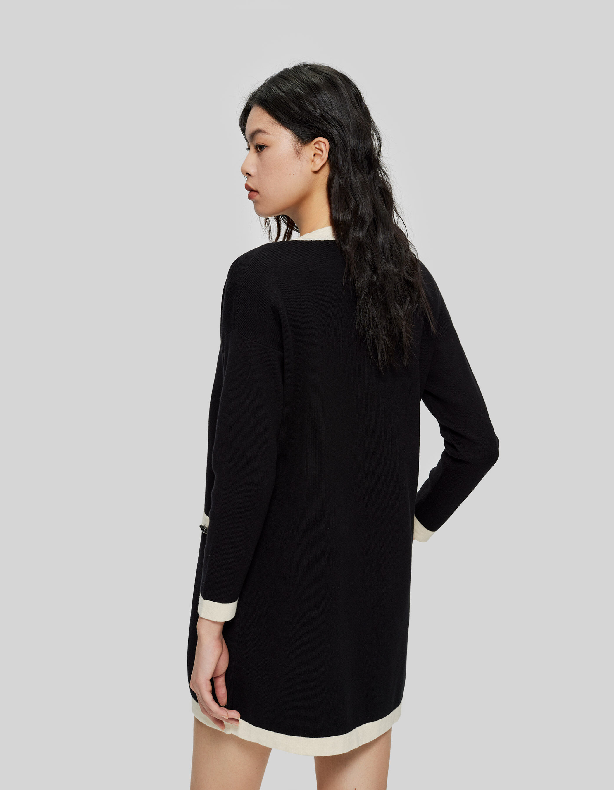 Women s black knit mid length cardigan with ecru edges