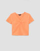 Orangefarbenes Mädchen-T-Shirt mit Schleife vorne-1