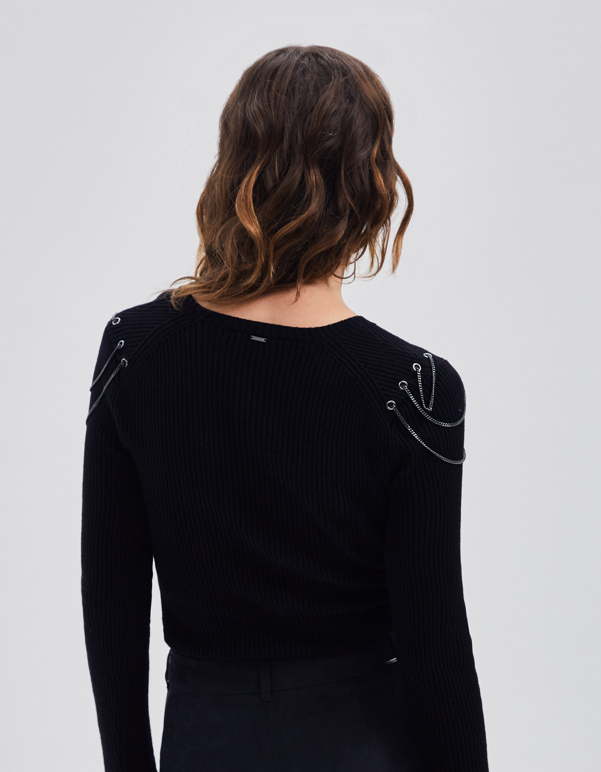 Women s black ribbed knit sweater with chains on shoulders