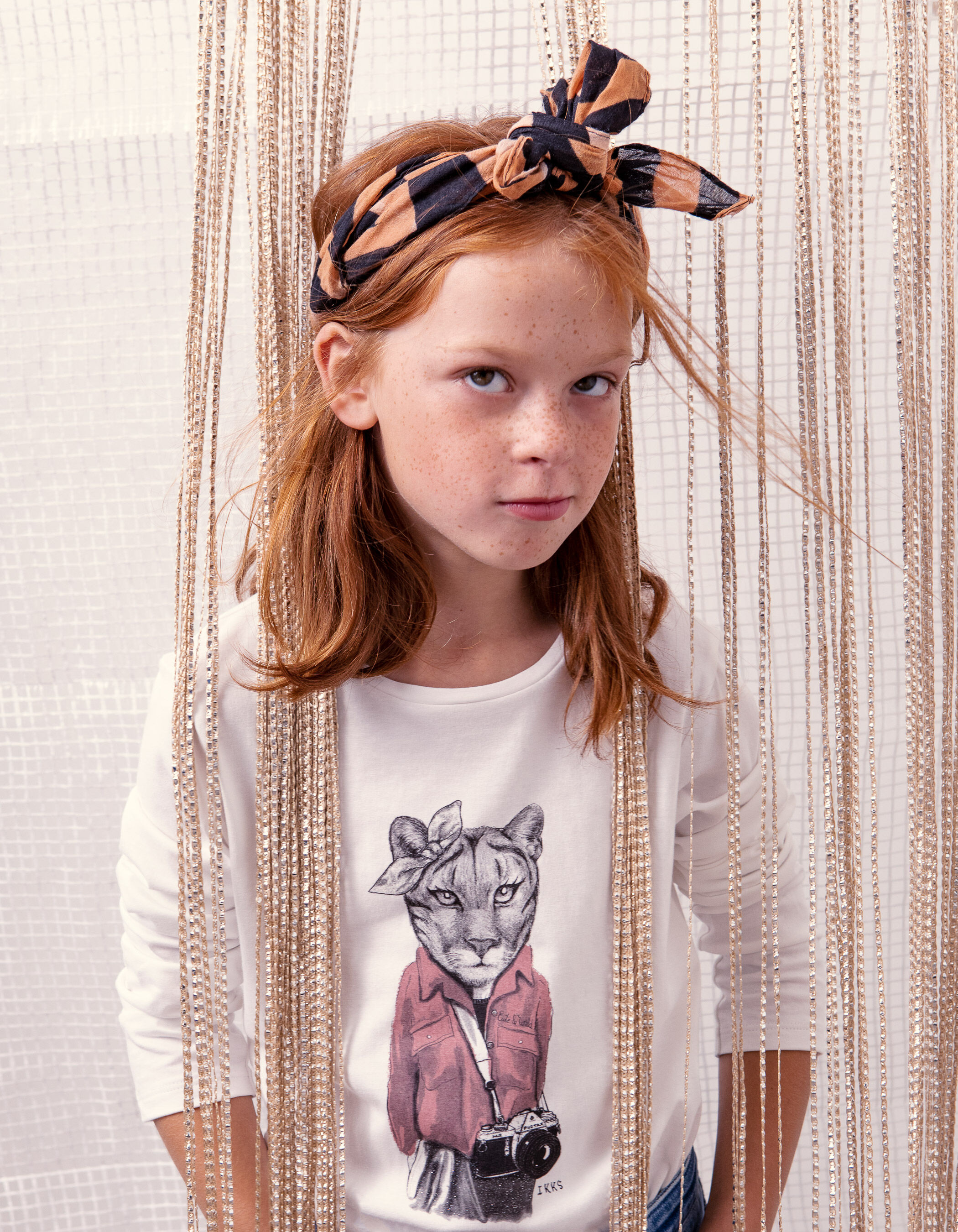 Girls off white lioness with bow T shirt