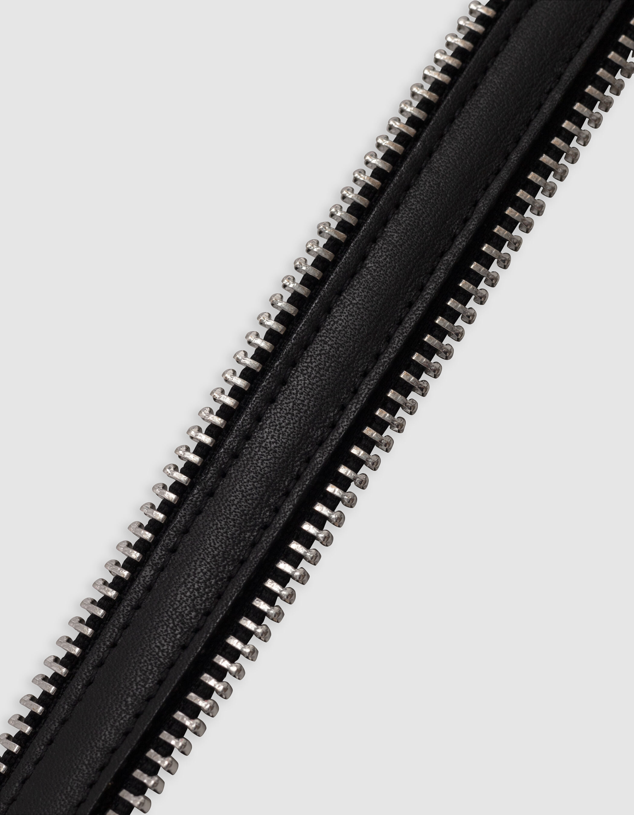 Women's black leather belt with metal-tipped zips