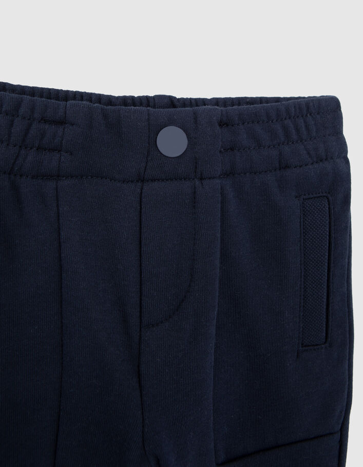 Baby boys' navy knit trousers with seamed pockets