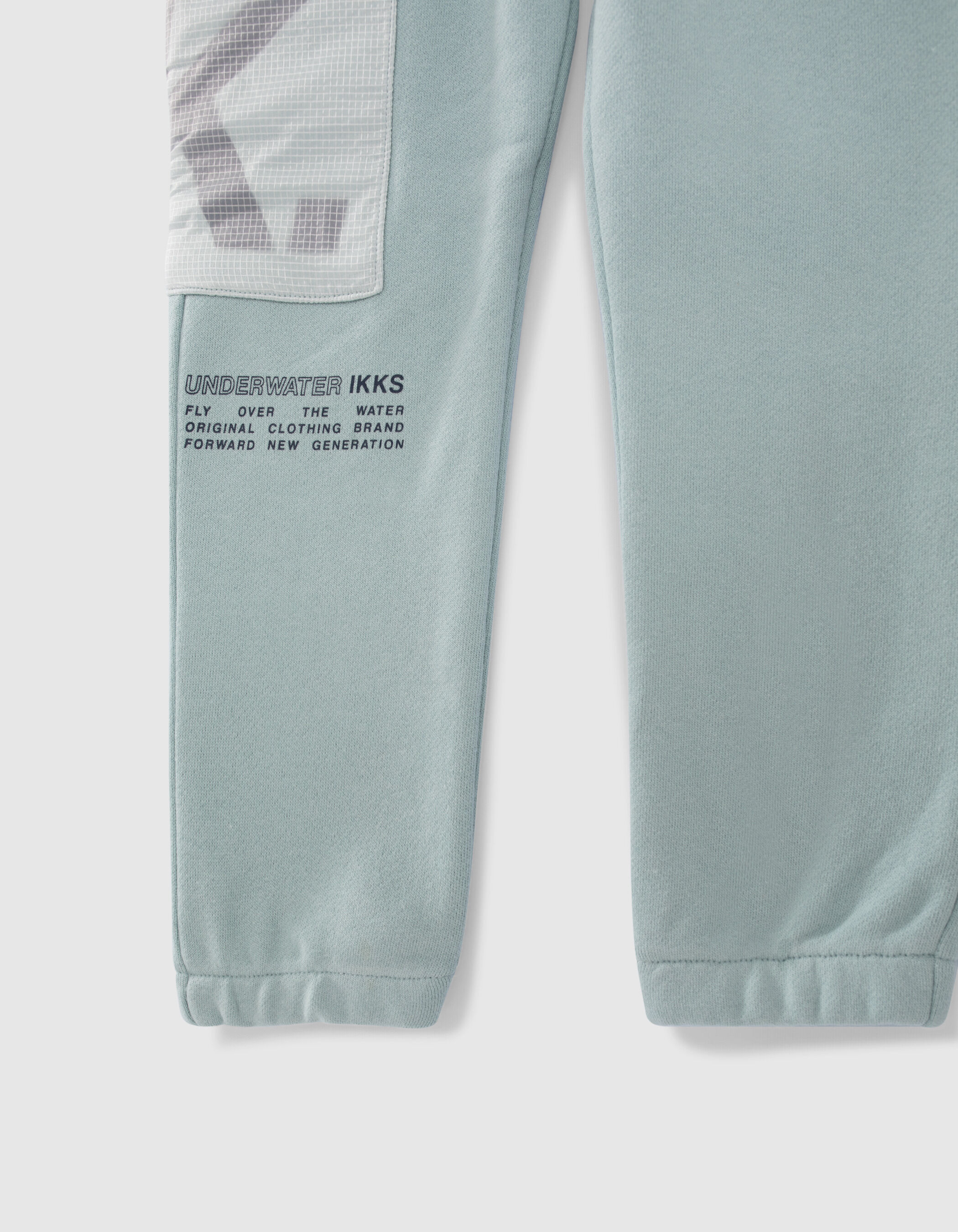 Boys aqua green joggers with nylon chequered pocket