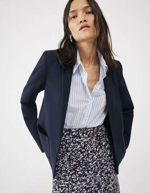Women’s navy suit jacket with striped collar and sleeves