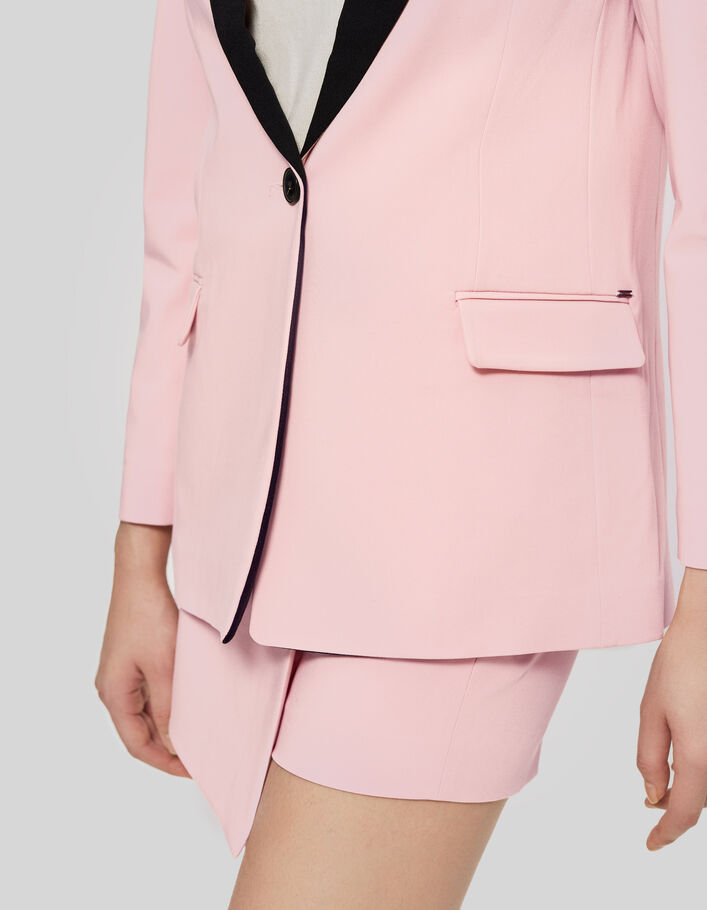Women’s pink suit jacket with black collar