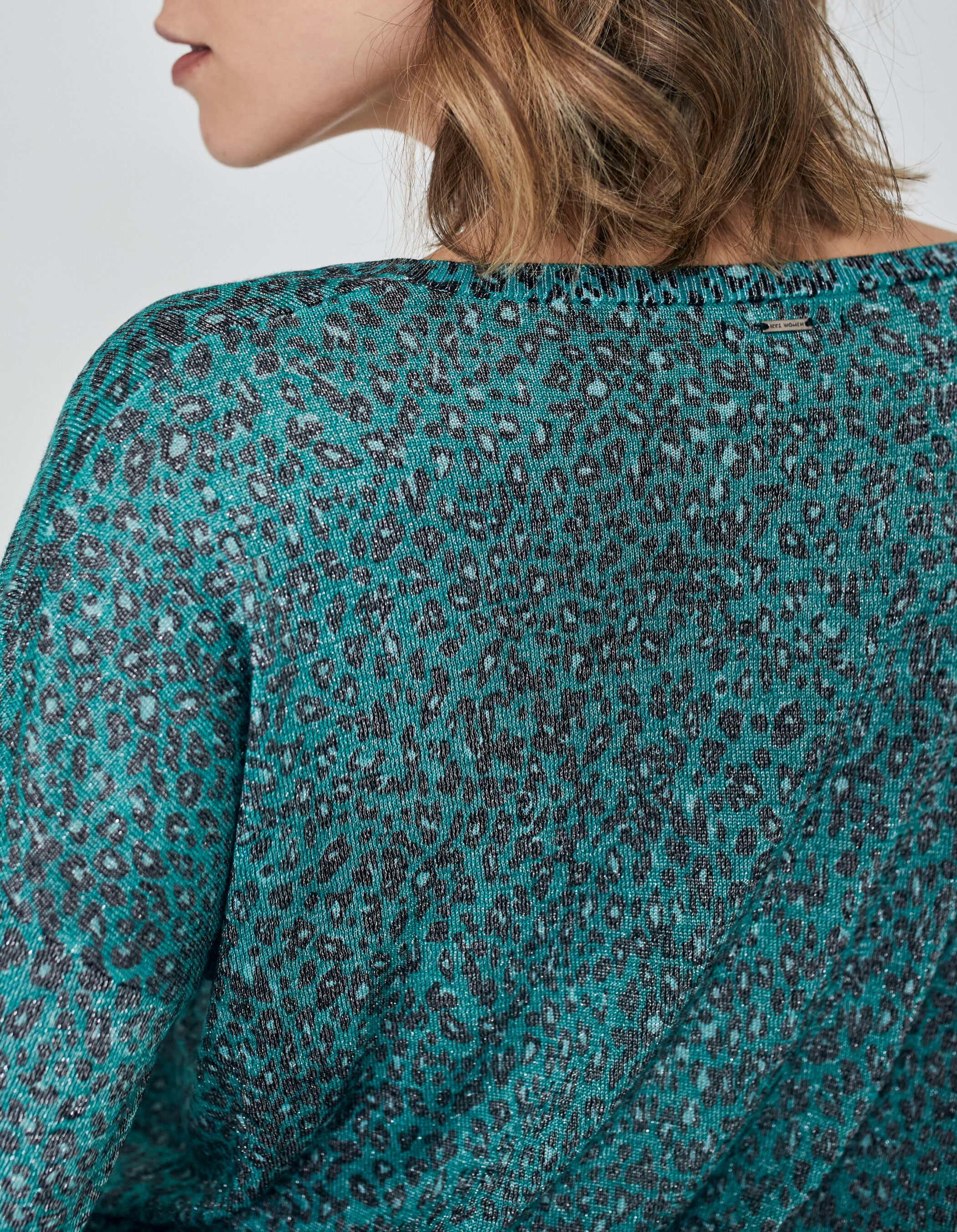 Green sweater with leopard sleeves sales