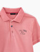 Polo rosa con print detrás y tejido niño -3