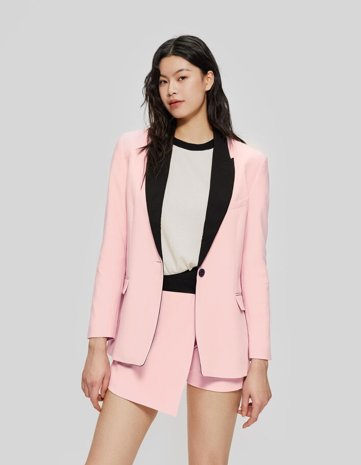 Women’s pink suit jacket with black collar