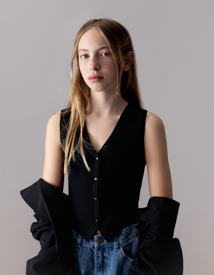 Girls’ black knit sleeveless waistcoat-1 Girls’ black knit sleeveless waistcoat-1
