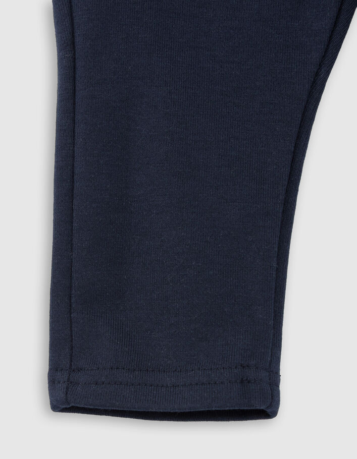 Baby boys' navy knit trousers with seamed pockets