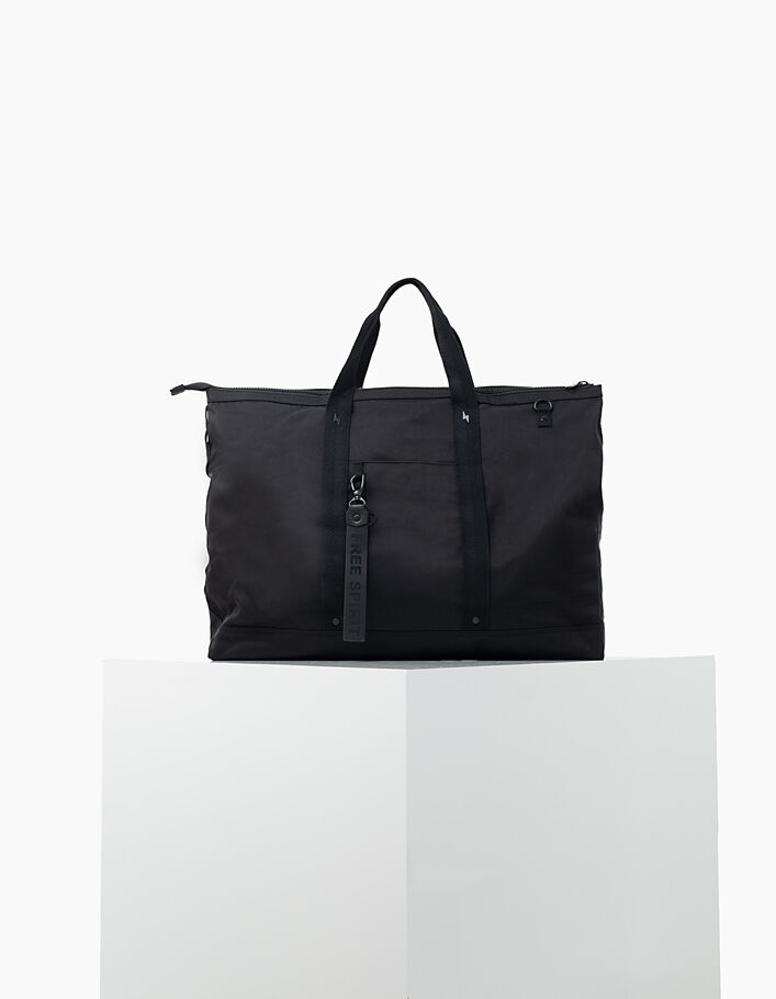 Women’s The Traveler black nylon travel bag