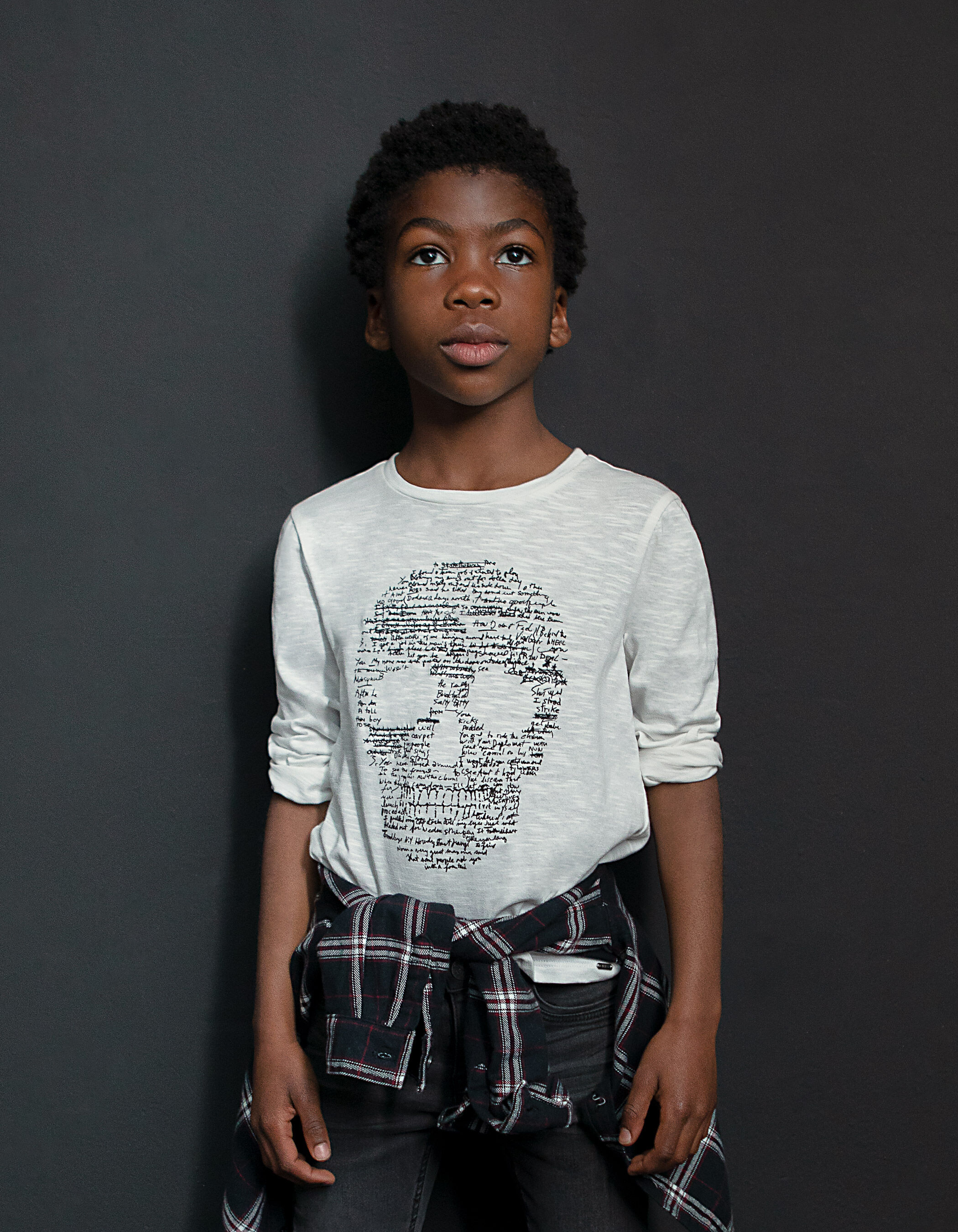 Boys off white T shirt with skull writing