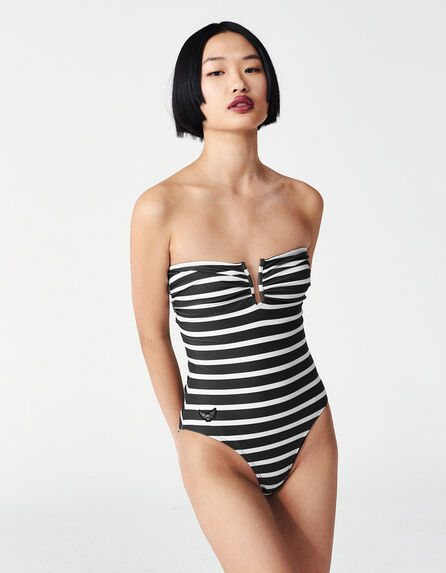 Women’s black swimsuit with ecru stripes and badges