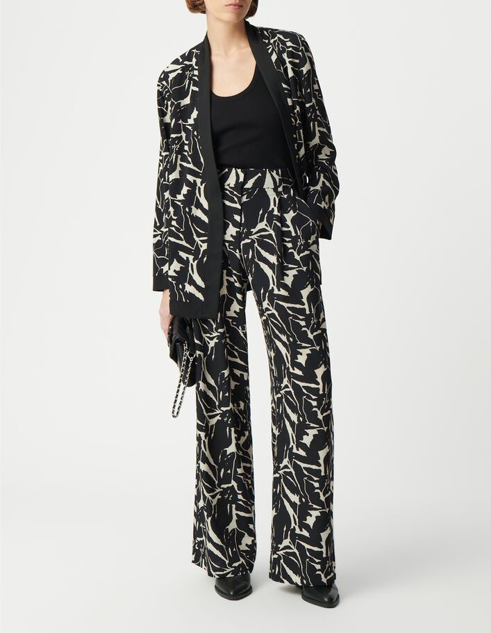 Pantalón negro fluido de mujer con estampado de flores de cebra
