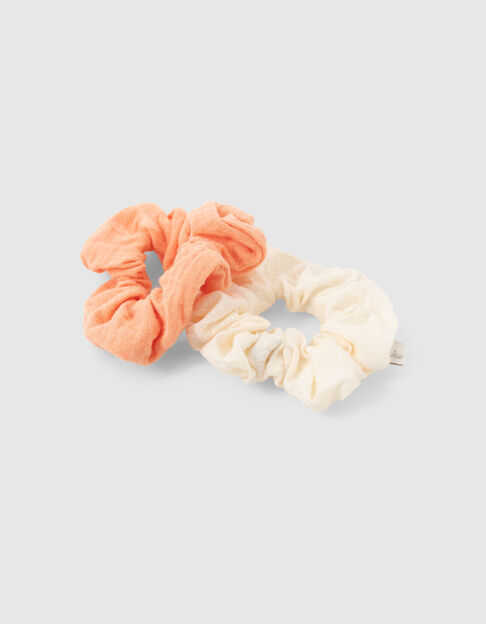 Girls’ orangey and embroidered white scrunchies