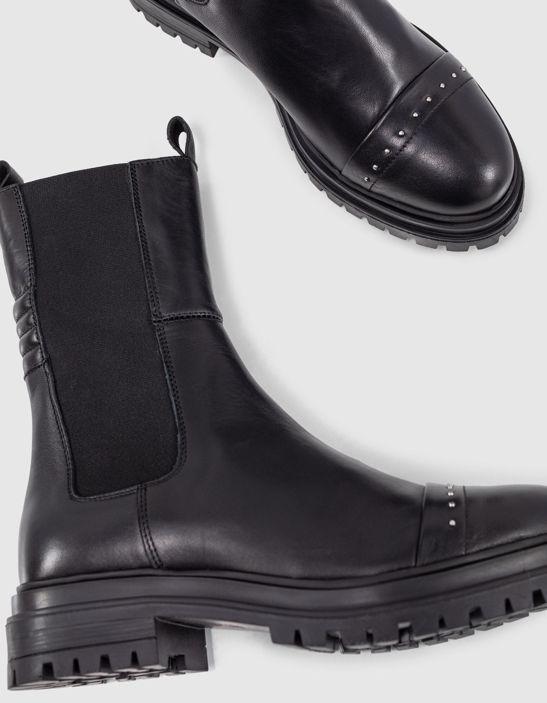 black studded leather high Chelsea boots