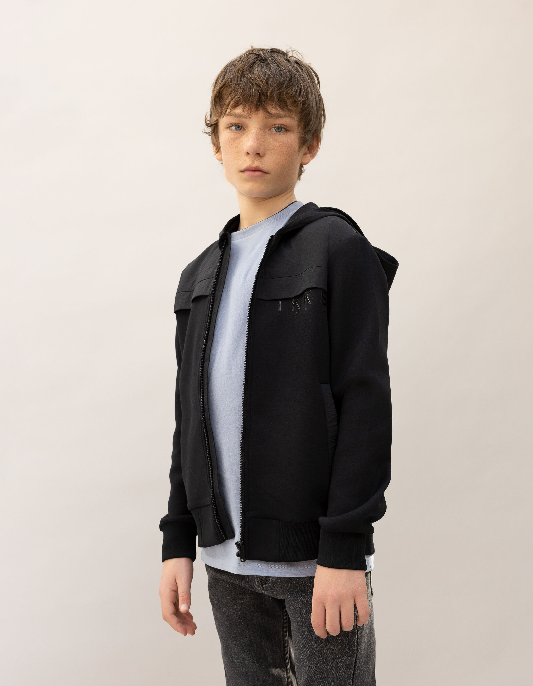 Cardigan zippé noir bi-matière logo verni garçon
