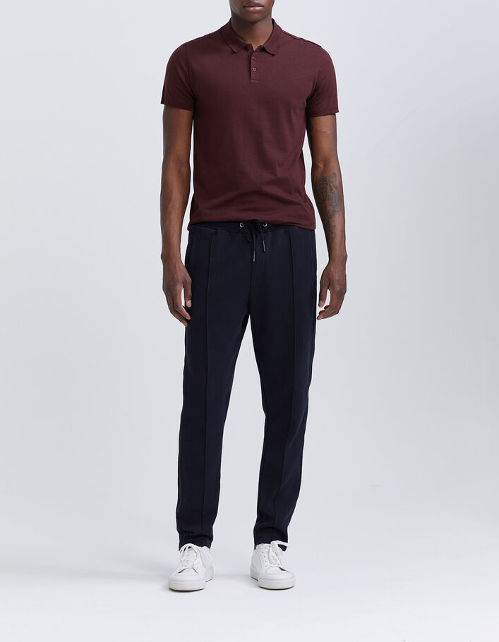 polo shirt and sweatpants