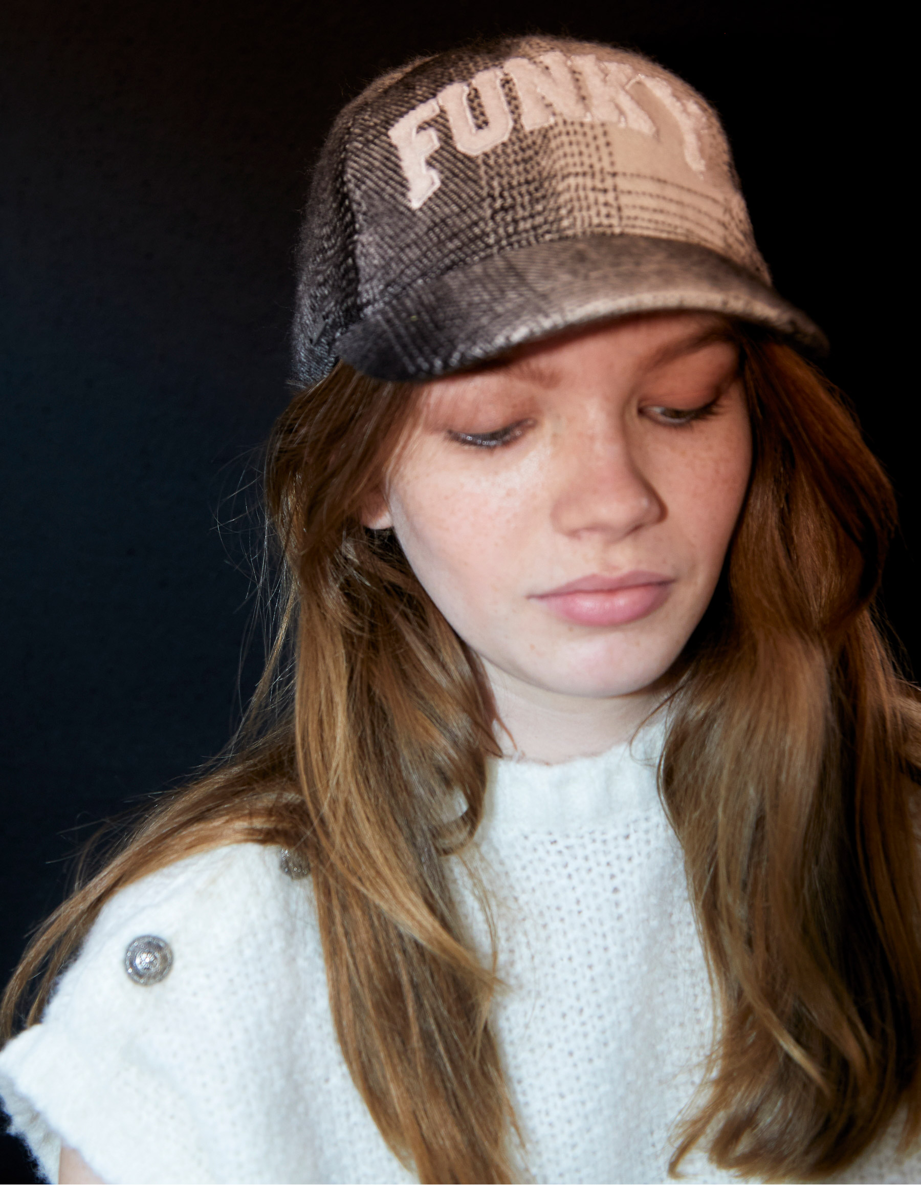 Girls’ black check cap with embroidered slogan