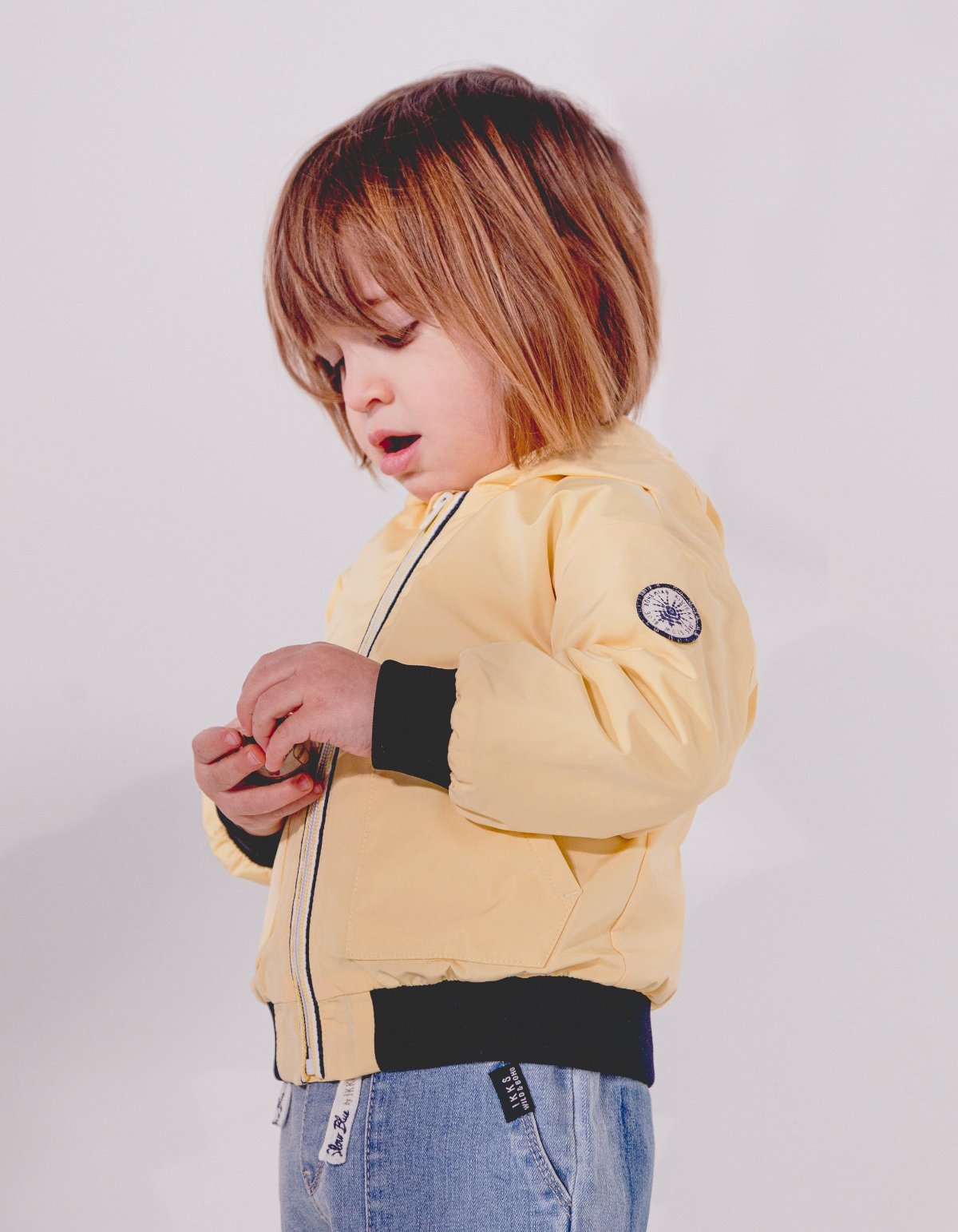 Baby boys’ yellow rubber windcheater with print on back