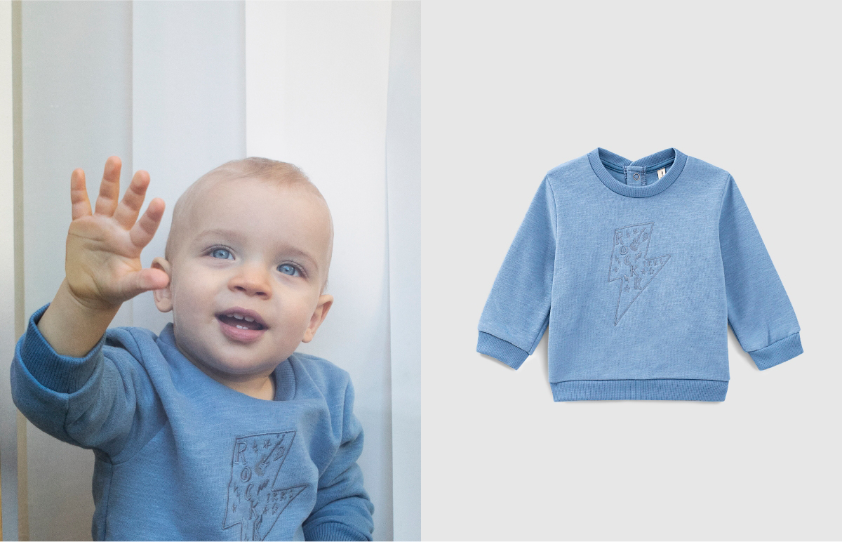 Middenblauwe sweater bliksemborduursel biosweatstof baby’s